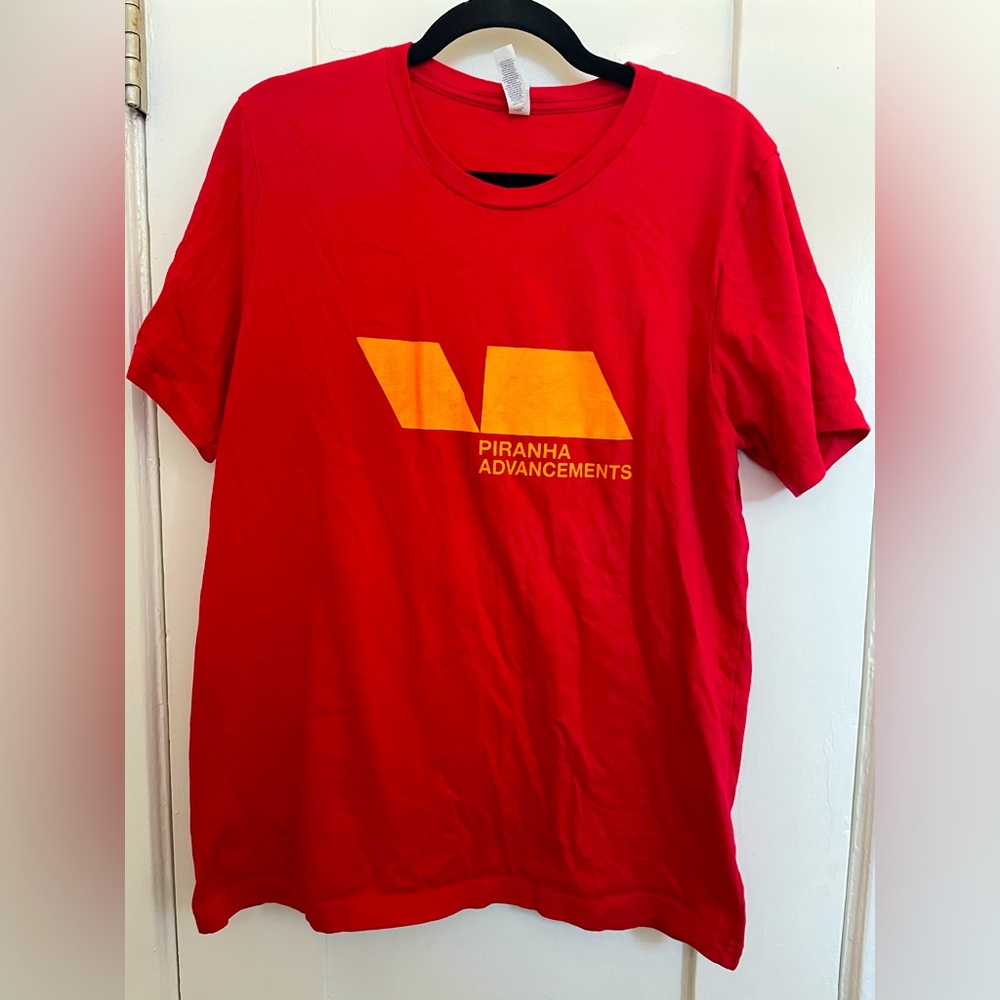 Large red Piranha Advancements graphic tee